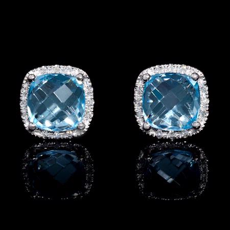 .07ct Diamond and Blue Topaz 14k White Gold Earrings.